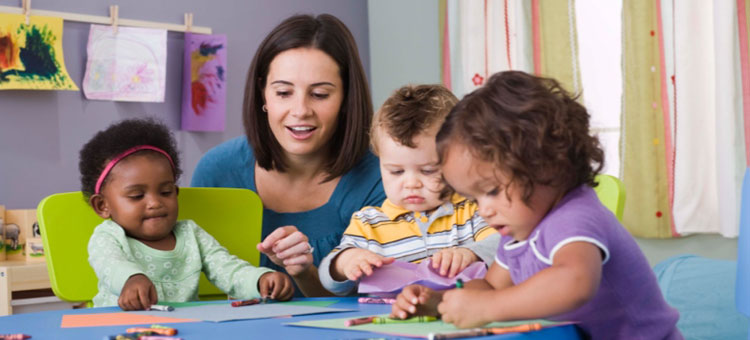 teacher helping children