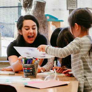 a teacher sharing art with students
