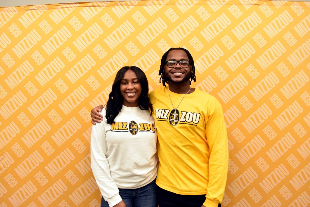 two people smiling for the camera